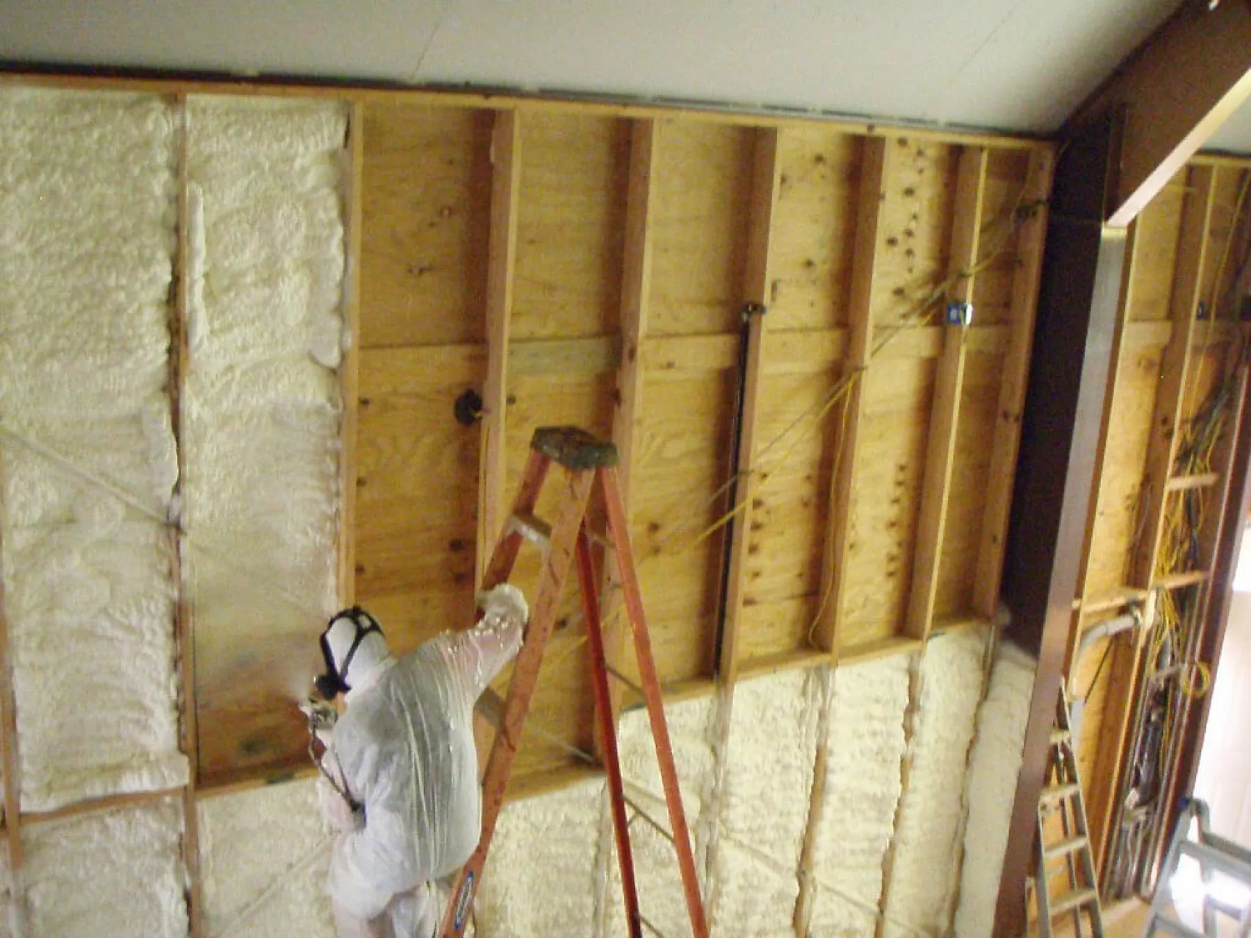 Modern attic with foam insulation improving home efficiency.