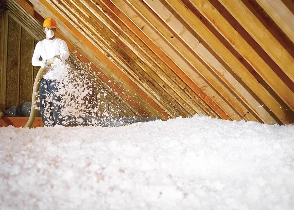 Blown-in insulation applied in an attic.