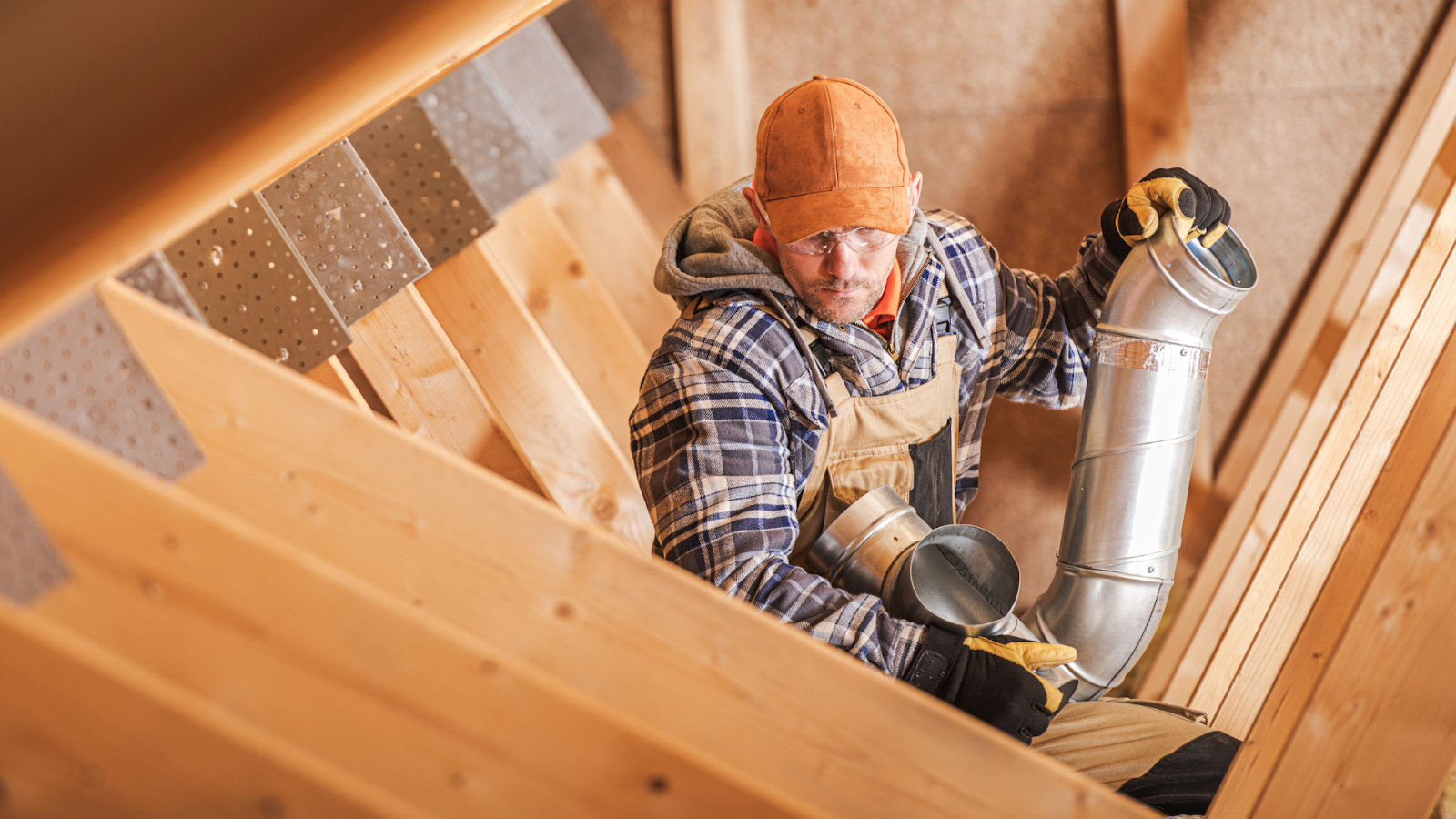 Installing attic insulation for improved home comfort and efficiency.