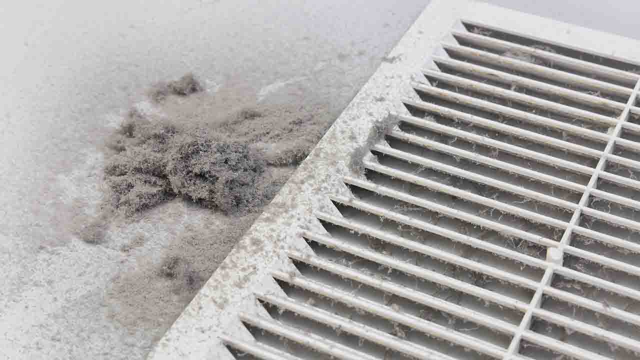 Dust and debris buildup inside residential air ducts.