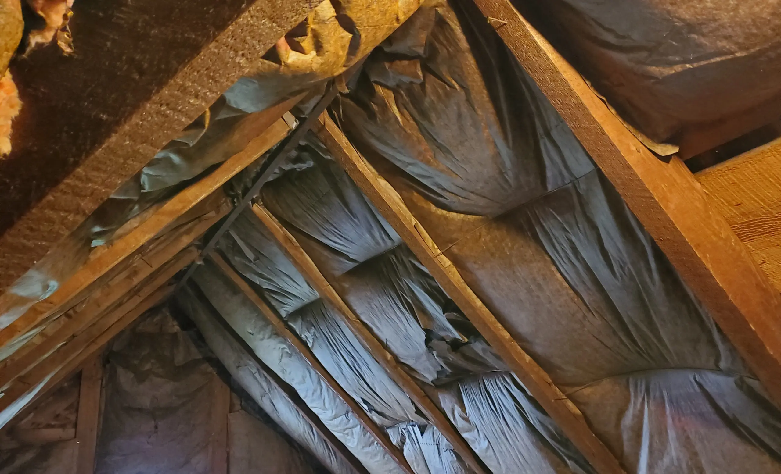 Attic floor covered with thick layers of insulation.